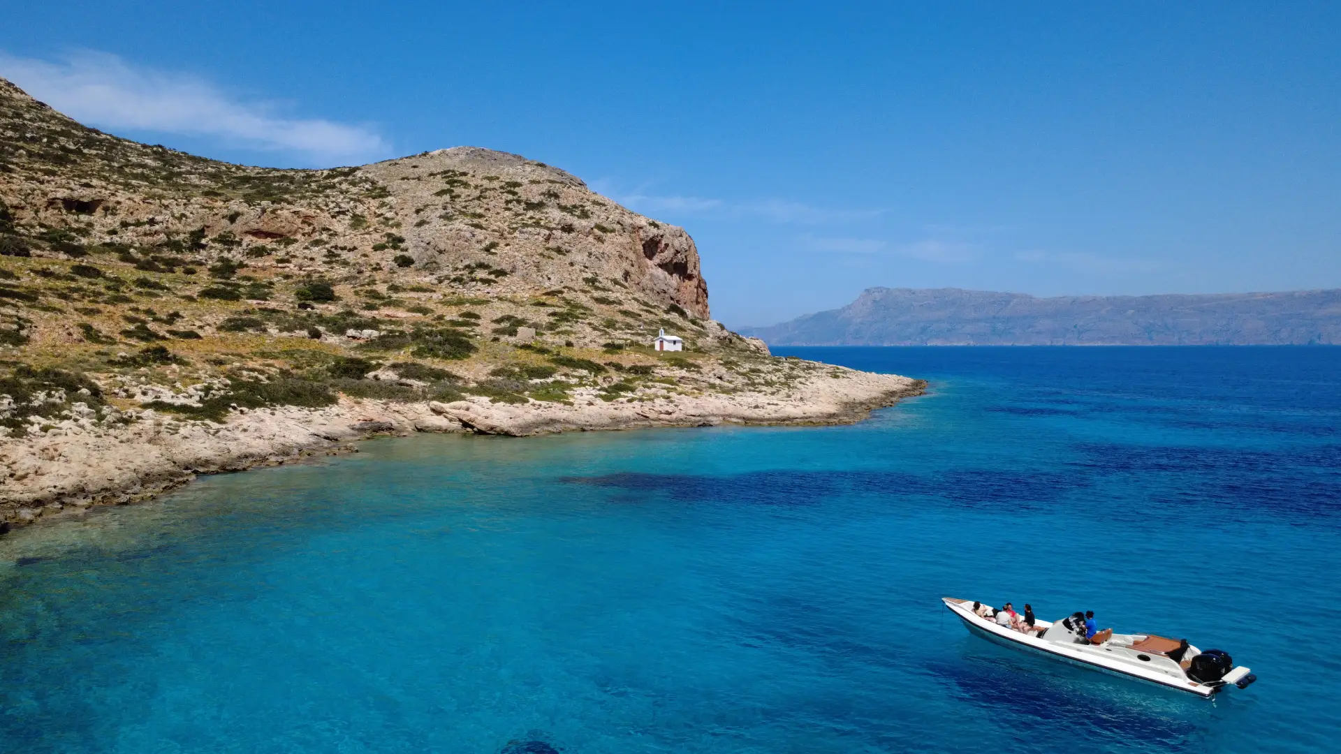 speedboat arriving in an secluded cove in Crete