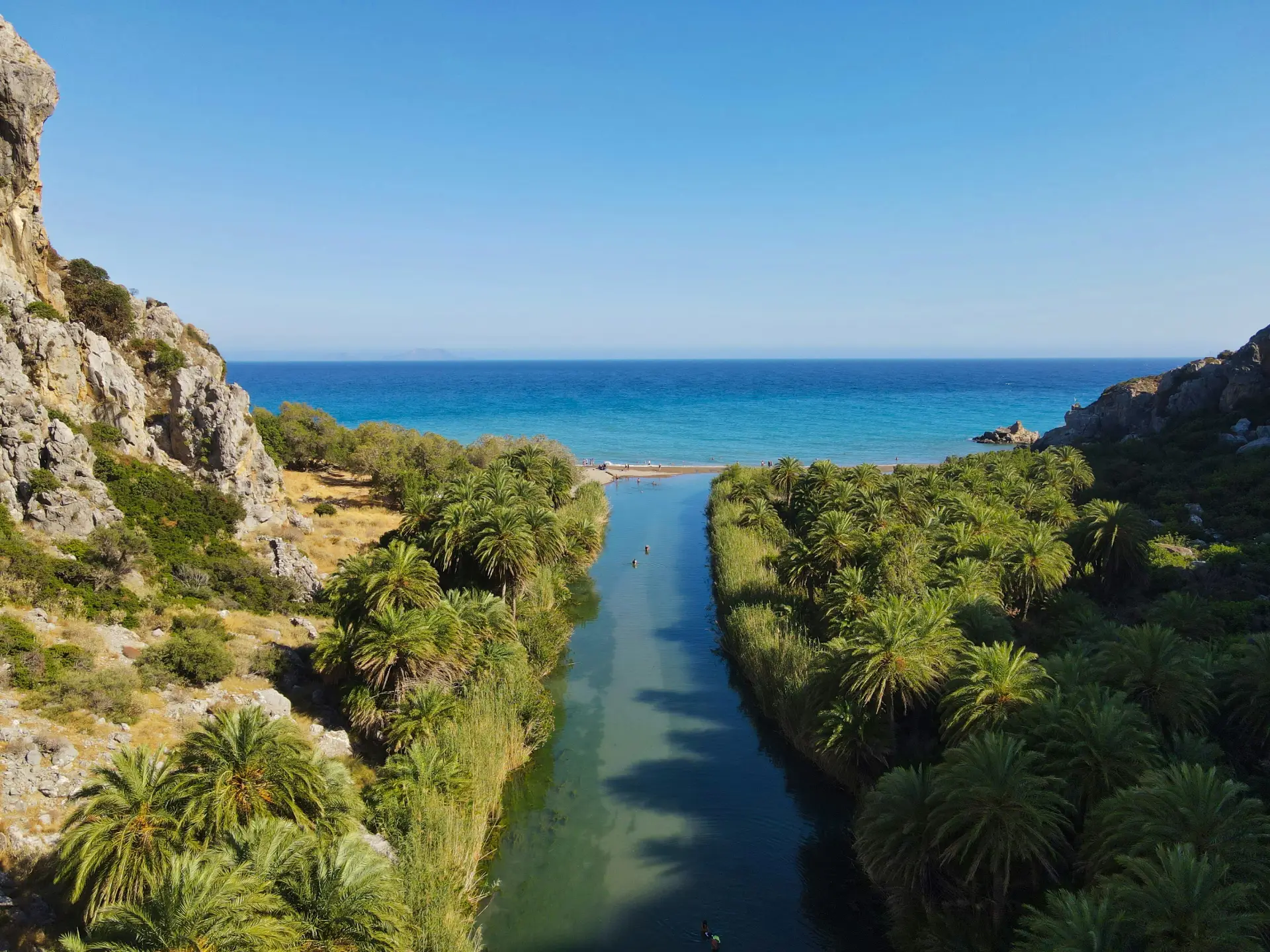 aerial view of Preveli beach the river crossing Palm trees