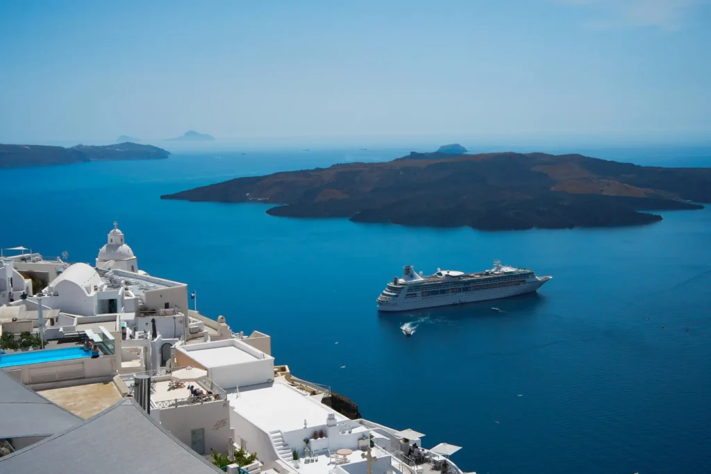 caldera santorini with a cruise ship on the water