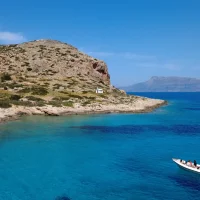 speedboat arriving in an secluded cove in Crete