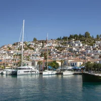 view of catamarans docked at the harbor of Poros