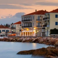 waterfront view of houses of Spetses at sunset time